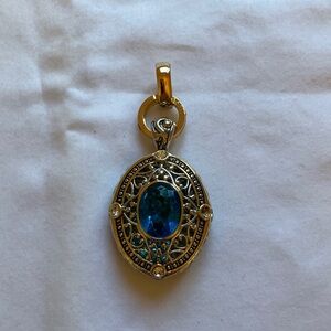 Gold and Silver Pendant with Blue Gemstone